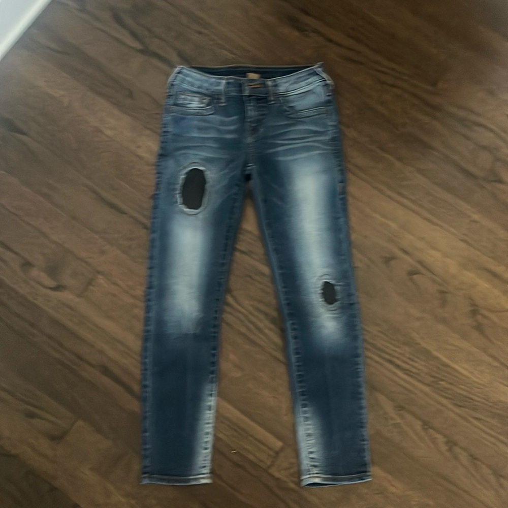 Like new True Religion girls size 8 jeans a with 2 black leather patches